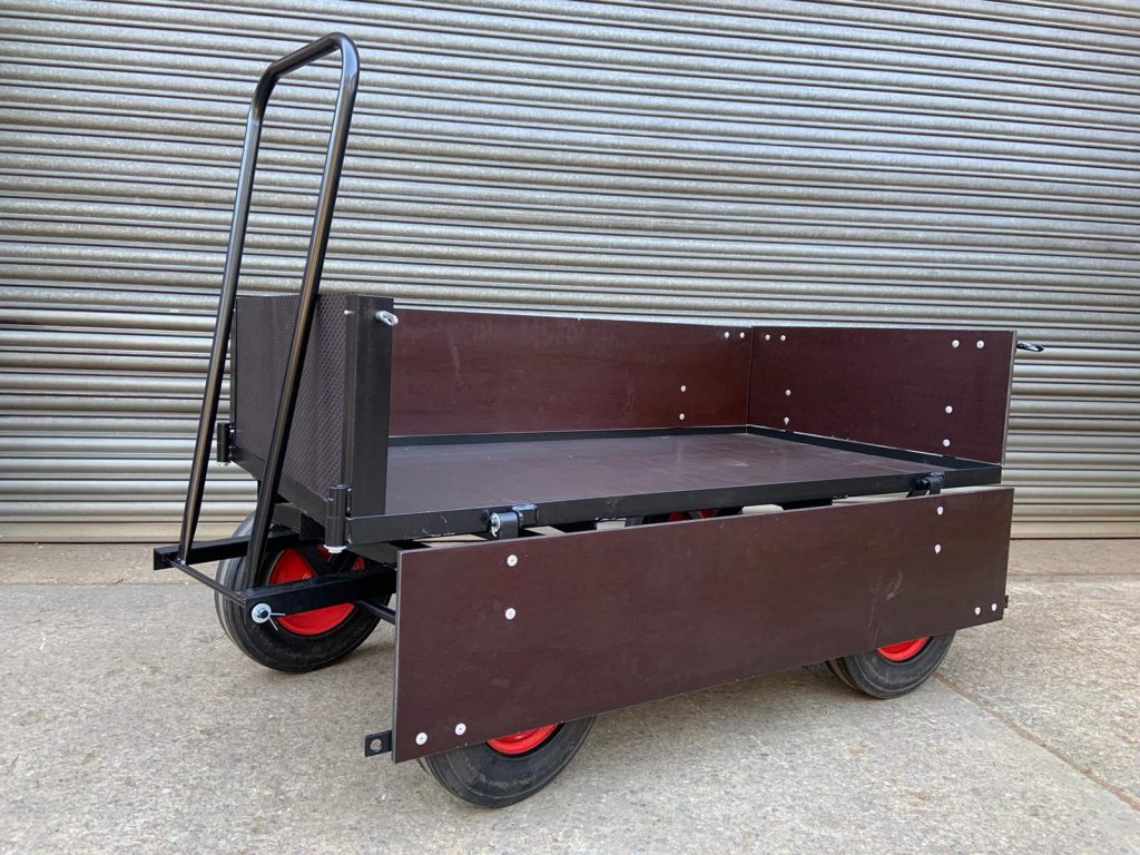 Hinged sided turntable truck